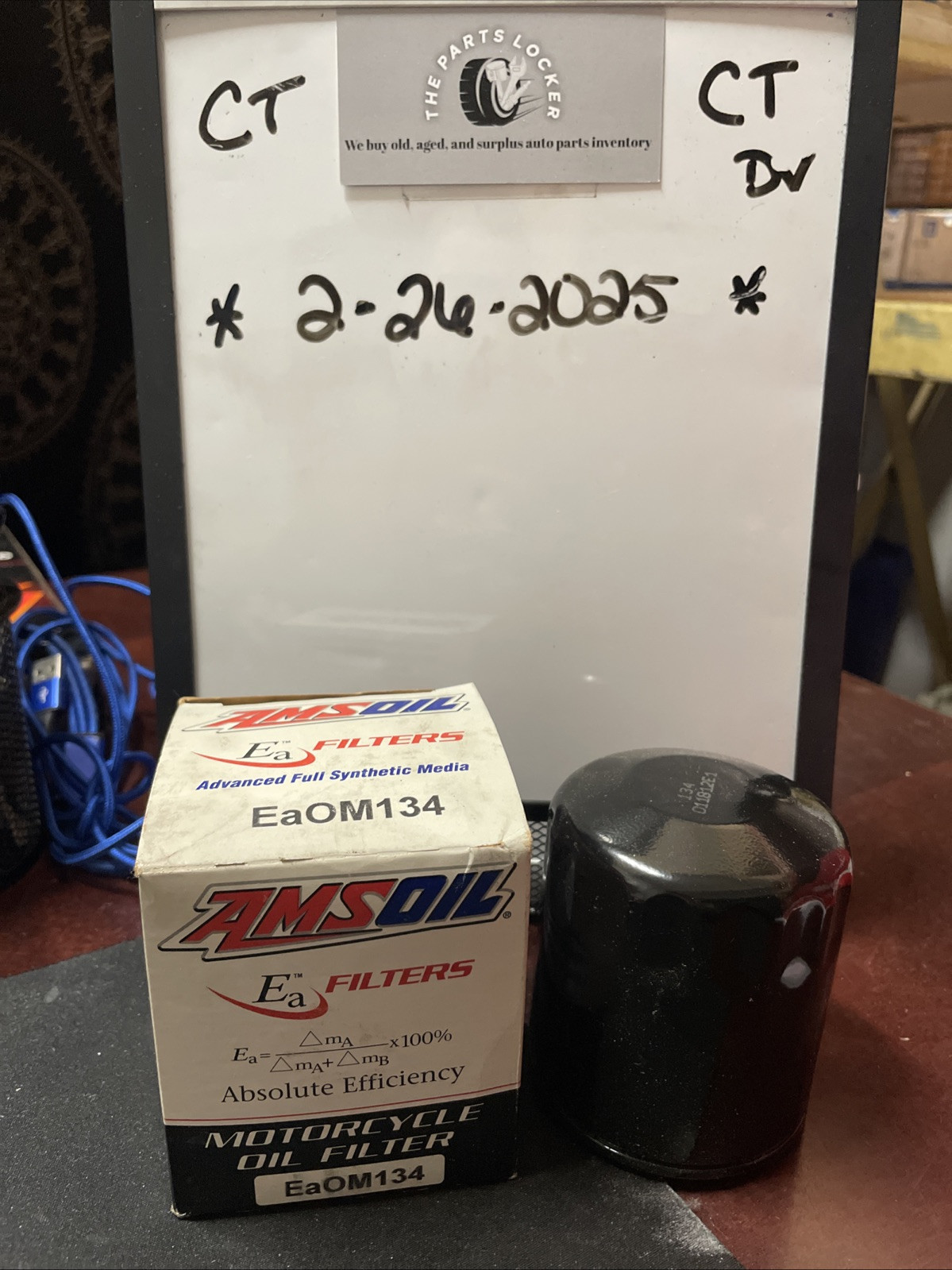 AMSOIL Oil Filter EAOM134 (3/4 underneath) Motorcycle